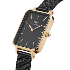 Quadro Pressed Ashfield Gold showcases a rectangular gold case with a deep black dial, gold hour markers, and a slim black mesh strap, offering a refined minimalist style ideal for women with petite wrists.