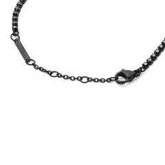Detail view of the Black Crystal Tennis Bracelet highlighting the lobster clasp, adjustable sizing rings, and sparkling black crystals set in a sleek stainless steel chain.
