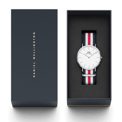 Classic Canterbury Silver presented in a sleek gift box, featuring a polished silver case, minimalist eggshell white dial, and a blue, red, and white striped NATO strap, ideal for gifting or everyday wear.