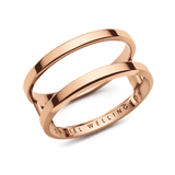 Rose gold Elan Dual Ring featuring a double-band design with minimalist lines, crafted from stainless steel and engraved with the Daniel Wellington logo on the inside.