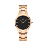 Daniel Wellington Iconic Link Black Rose Gold watch with a round black dial, slim rose gold hour markers, and a rose gold stainless steel bracelet, designed for both men and women.
