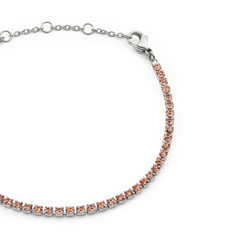 Close-up of the Classic Tennis Bracelet Apricot Silver, featuring apricot-coloured crystals set in a slim silver chain with an adjustable lobster clasp and sizing rings.
