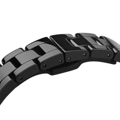 Detail view of the Iconic Link Ceramic watch bracelet, showing the glossy black ceramic links and secure clasp designed for a comfortable fit and scratch resistance.