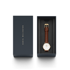 Petite St Mawes Gold presented in a sleek Daniel Wellington gift box, featuring a gold-plated case, minimalist white dial, and brown leather strap, ideal for gifting or adding a classic gold watch to your collection.