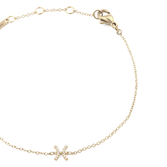 Close-up of the Crystal Zodiac Chain Bracelet Gold, highlighting the slim gold chain, adjustable sizing rings, and a sparkling Pisces zodiac charm set with crystals.