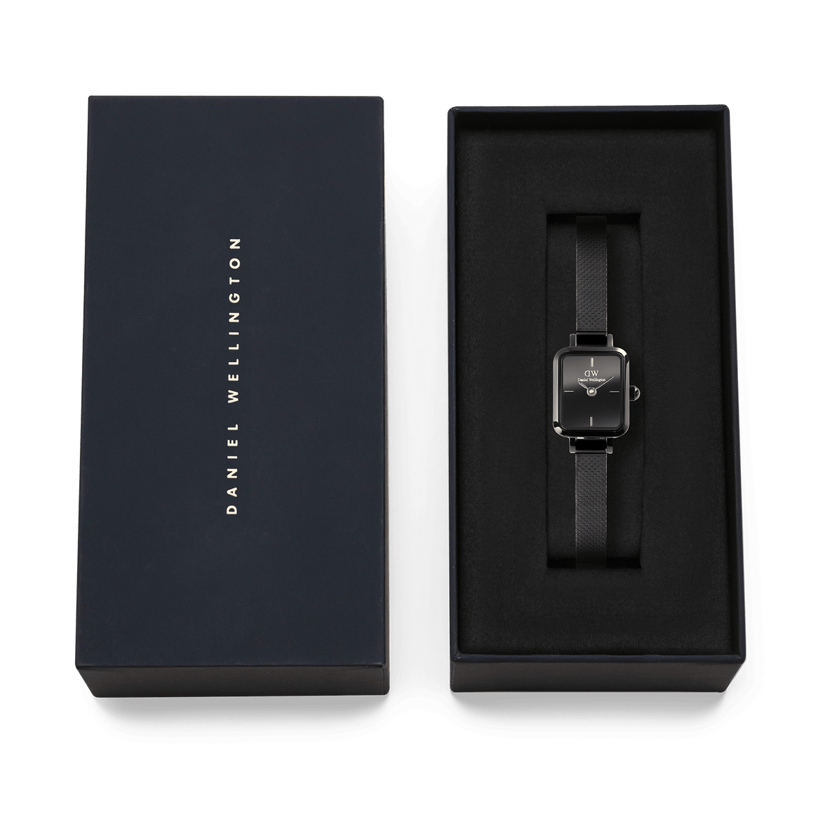 Quadro Mini Reflection Black watch with a rectangular black dial and slim mesh strap, presented in a Daniel Wellington gift box, ideal for gifting or adding to your collection.