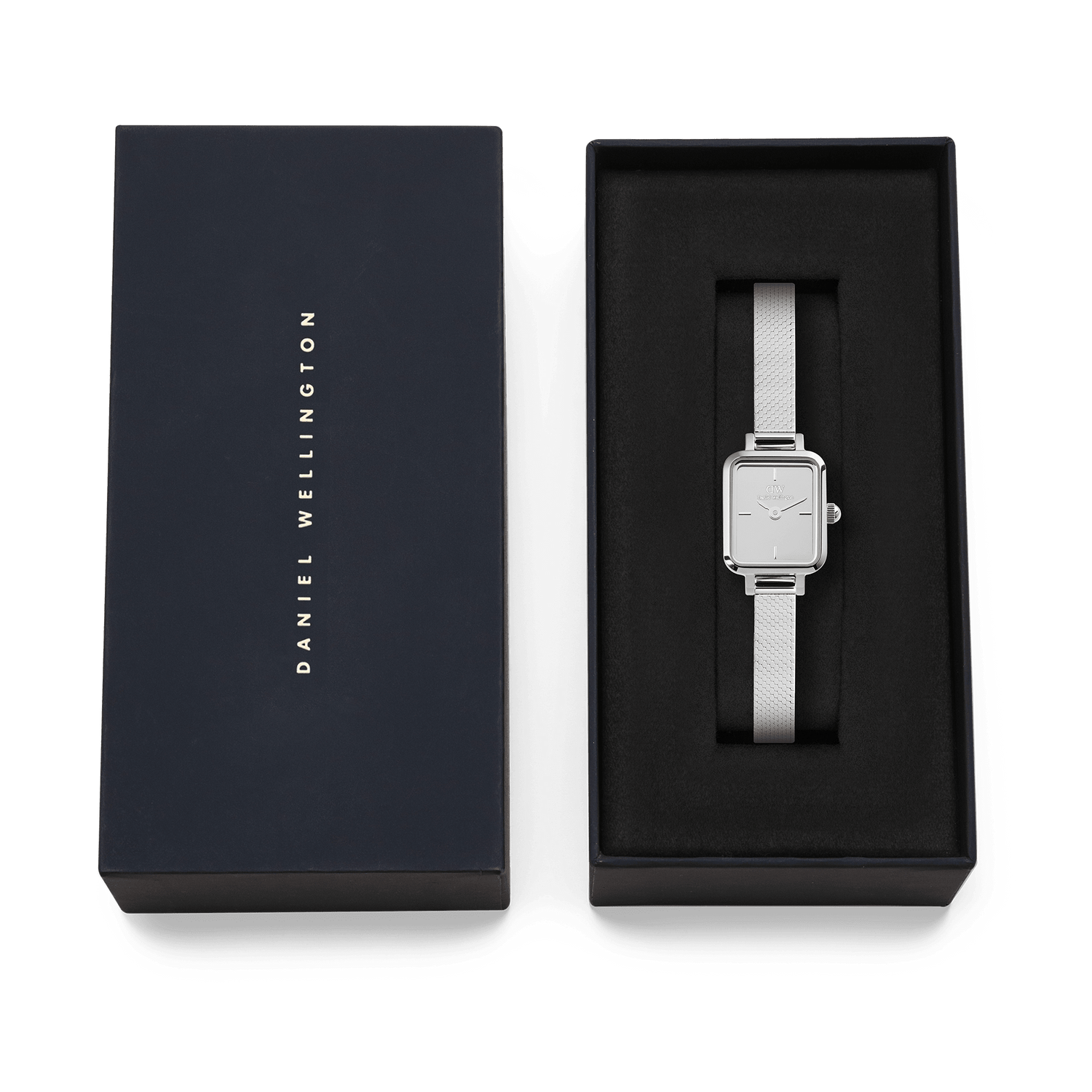 Quadro Mini Reflection Silver watch with a slim rectangular case and polished mesh strap, presented in an elegant Daniel Wellington gift box, ideal for gifting or adding to your collection.