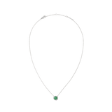Silver necklace with a fine chain featuring a round green jade pendant framed by white cubic zirconia crystals, offering a minimalist and elegant look.