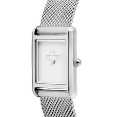 Close-up of the Bound Mini Sterling ladies watch showing its polished rectangular silver-tone case, minimalist white dial, and finely woven stainless steel mesh strap.