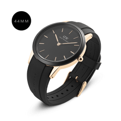 Daniel Wellington Iconic Motion Rose Gold watch in 44mm size, featuring a rose gold stainless steel case, minimalist black dial with rose gold details, and a black FKM rubber strap for a modern, sporty style.