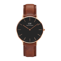 Classic St Mawes Black Rose Gold watch featuring a minimalist black dial with rose gold markers and hands, set in a polished rose gold case and paired with a brown leather strap.