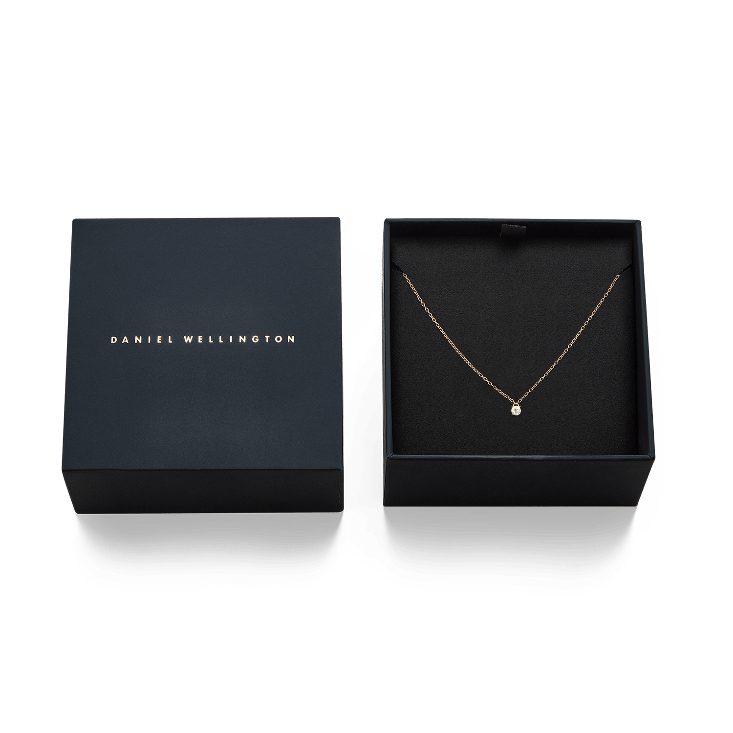 Mirelle Solitaire Necklace Rose Gold displayed in an elegant black gift box, highlighting the delicate rose gold chain and white cubic zirconia pendant.