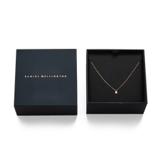 Mirelle Solitaire Necklace Rose Gold displayed in an elegant black gift box, highlighting the delicate rose gold chain and white cubic zirconia pendant.