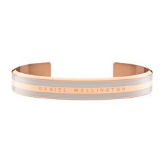 Wide rose gold cuff bracelet with desert sand enamel detailing and Daniel Wellington branding, featuring a smooth, minimalist design suitable for both men and women.