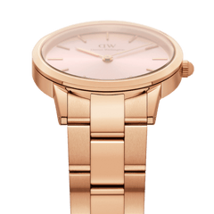 Detail view of the Iconic Link Pink Rose Gold ladies watch showing the brushed rose gold stainless steel link bracelet and the soft pink sunray dial with minimalist gold markers.