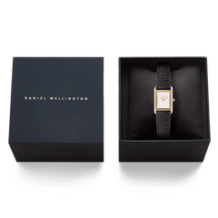 Daniel Wellington Bound Mini Black Lizard Rose Gold watch presented in an elegant black gift box, with the textured black leather strap and slim rectangular rose gold case displayed next to the branded lid.