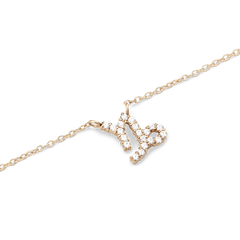 Close-up of the Crystal Zodiac Chain Necklace Gold featuring a Capricorn pendant set with sparkling crystals on a fine gold chain, highlighting its elegant and modern design.