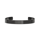 A minimalist graphite cuff bracelet with a brushed finish, featuring a slim 7 mm width and open design for easy adjustment and comfortable everyday wear.