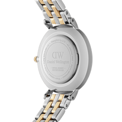Close-up of the back of the Petite Lumine Bezel 5-Link Two-Tone MOP Silver ladies watch, showing the engraved case and the gold and silver stainless steel bracelet.