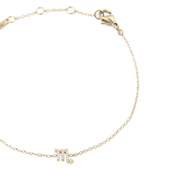 Close-up of the Crystal Zodiac Chain Bracelet Gold, highlighting the fine gold chain, adjustable sizing rings, and a sparkling Scorpio zodiac charm set with crystals.