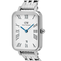 Close-up of the Quadro Roman Numerals Date 5-link Silver watch, highlighting the rectangular stainless steel case, crisp white dial with bold Roman numerals, blue hands, date window at 6 o’clock, and the detailed guilloché pattern.
