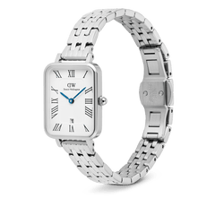 Quadro Roman Numerals Date 5-link Silver watch with a rectangular stainless steel case, polished 5-link bracelet, white dial featuring bold Roman numerals, blue hands, and a date window at 6 o’clock, shown with a butterfly clasp and adjustable strap.