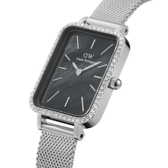 Quadro Lumine Bezel Sterling Black MOP features a rectangular black mother of pearl dial with gemstone bezel detailing and a slim silver mesh strap, highlighting its elegant and modern design for women.
