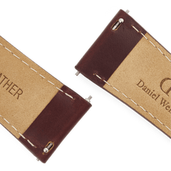 Close-up of the underside of the Tapered St Mawes Strap Gold, showing genuine brown leather with white stitching and quick-release spring bars for easy attachment to a watch.