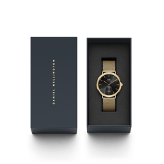 Classic Multi-Eye Evergold Onyx men's watch with a black multi-eye dial and gold mesh strap, presented in a sleek Daniel Wellington gift box.
