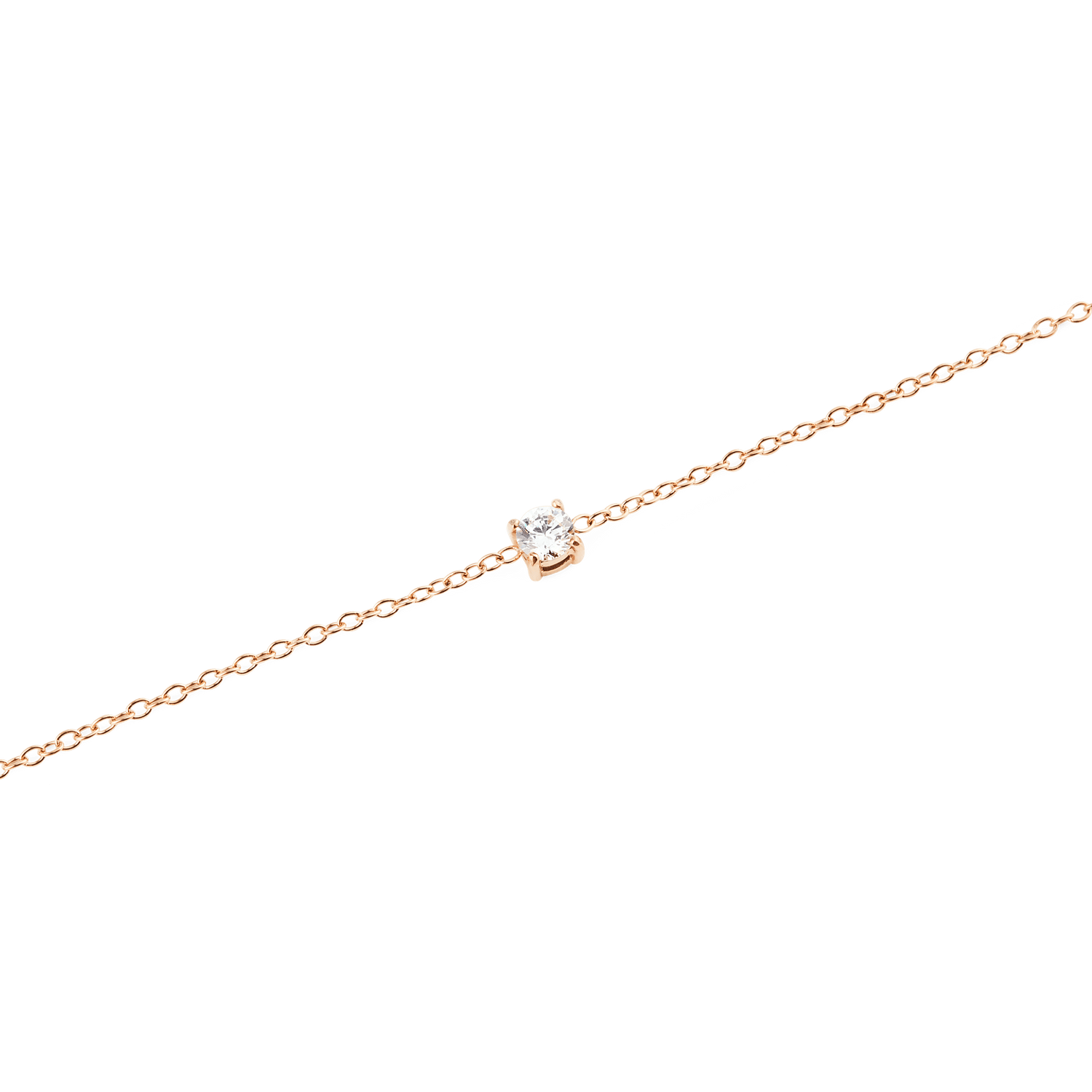 Close-up of the Mirelle Solitaire Bracelet Rose Gold, highlighting the slim rose gold chain and the single white cubic zirconia crystal in a minimal setting.