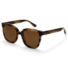 Grande Bio-Acetate Brown Demi sunglasses with a square brown demi frame, amber lenses, and subtle Daniel Wellington branding on the temples, offering a stylish and comfortable fit for women.