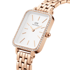 Close-up of the Quadro Lumine Bezel 5-Link Melrose, showing its rose gold rectangular case, crystal-set bezel, white minimalist dial, and five-link strap, highlighting its elegant and refined design.