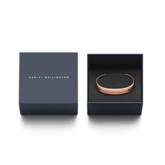 Emalie Bracelet Dusty Rose Rose Gold presented in a sleek Daniel Wellington gift box, highlighting its rose gold and pink enamel cuff design as a stylish jewellery gift option.