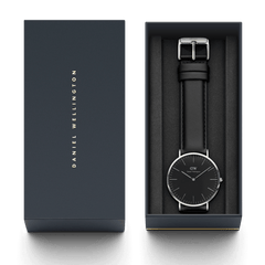Classic Sheffield Black Silver watch presented in a Daniel Wellington branded gift box, featuring a minimalist black dial, polished silver case, and genuine black leather strap, ideal for gifting or special occasions.