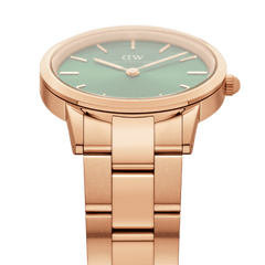 Close-up of the Iconic Link Emerald Green Rose Gold watch, highlighting the polished rose gold stainless steel bracelet and the vibrant emerald green dial with minimalist hour markers.