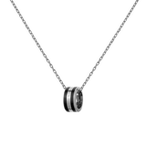 A minimalist silver chain necklace featuring a circular black enamel pendant with subtle branding, designed for a modern and elegant look.