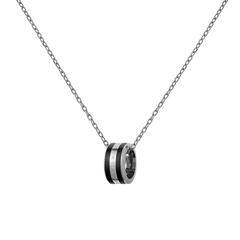 A minimalist silver chain necklace featuring a circular black enamel pendant with subtle branding, designed for a modern and elegant look.