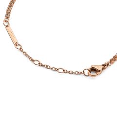 Detail view of the Classic Tennis Bracelet Apricot Rose Gold, highlighting the adjustable chain, lobster clasp, and individually set apricot-coloured crystals.