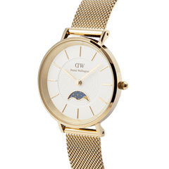 Petite Lune Evergold gold ladies watch with a white textured dial, gold hour markers, moon-phase sub-dial, and a slim gold mesh strap, shown from a side angle to highlight its elegant design.