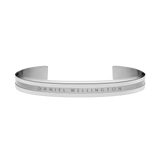 Classic Elan Bracelet Silver in stainless steel with a brushed and polished finish, featuring a subtle Daniel Wellington logo engraved on the front and a slim, open cuff design.