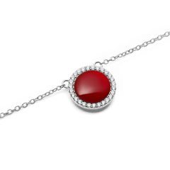 Close-up of the Audrey Necklace Red Agathe Silver, showcasing a vivid red agate stone encircled by sparkling white cubic zirconia crystals on a fine silver chain.