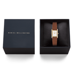 Bound Mini Light Brown Lizard Gold watch presented in a sleek black Daniel Wellington gift box, showcasing its gold rectangular case and textured light brown lizard-embossed leather strap.