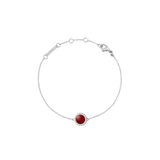 Delicate silver bracelet featuring a domed red agate centrepiece surrounded by a halo of white cubic zirconia crystals, with an adjustable chain and lobster clasp.