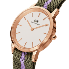 Close-up of the Iconic NATO Green/Purple Rose Gold ladies watch featuring a rose gold case, minimalist white dial, and a green and purple recycled nylon NATO strap, highlighting its refined details and petite design.