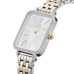 Quadro Lumine Bezel 5-Link Two-Tone MOP ladies watch featuring a rectangular mother of pearl dial, crystal-set bezel, and a five-link bracelet in polished stainless steel and gold, shown in a close-up angle highlighting its elegant details.