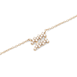 Close-up of the Crystal Zodiac Chain Necklace Gold featuring an Aquarius pendant set with sparkling crystals on a fine gold chain, highlighting its elegant and personal design.