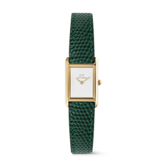 A ladies gold watch with a slim rectangular case, crisp white dial, and a green lizard-embossed leather strap, combining elegant design with a distinctive textured finish.