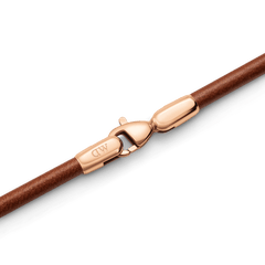 Close-up of the St Mawes Bracelet Rose Gold, showing the brown leather band and rose gold-plated stainless steel lobster clasp with a secure fastening.