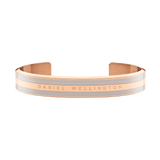 Emalie Bracelet Desert Sand Rose Gold displays a wide, double-plated stainless steel cuff with rose gold and desert sand enamel, finished with Daniel Wellington branding for a sophisticated, modern look.
