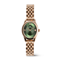 Rose gold ladies watch with an oval case, emerald green sunray dial featuring Roman numerals, and a beans link bracelet, designed for everyday elegance and versatility.